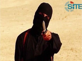 This file image grab from a video released by the Islamic State (IS) and identified by private terrorism monitor SITE Intelligence Group purportedly shows a masked militant holding a knife and gesturing as he speaks to the camera.