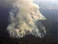 Aerial picture showing smoke from a two-kilometre-long stretch of fire billowing from the Amazon rainforest about 65 km from Porto Velho, in the state of Rondonia, in northern Brazil.