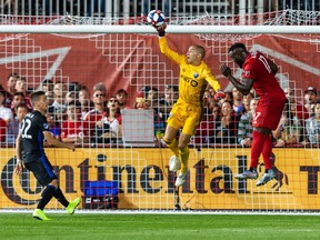 Montreal Impact goalkeeper Evan Bush (1) makes a save against Toronto FC forward Jozy Altidore (17) during the second half at Rogers Centre.