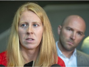 Canadian canoe/kayaker Laurence Vincent Lapointe responds to a positive doping result as her lawyer, Adam Klevinas, looks on as she speaks to the media Tuesday, August 20, 2019 in Montreal.