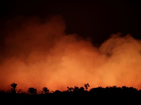 Smoke billows during a fire in an area of the Amazon rainforest near Humaita, Amazonas State, Brazil, on Aug. 17, 2019.