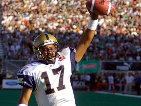Winnipeg Blue Bombers' quarterback Khari Jones runs in a first half touchdown against the Saskatchewan Roughriders on Aug. 31, 2003 in Regina.