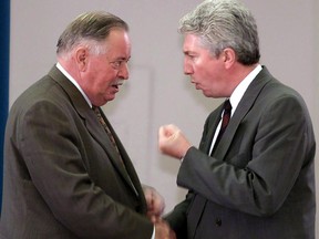 Bloc Quebecois Leader Gilles Duceppe (right) shakes hands with former Quebec premier Jacques Parizeau after Parizeau addressed the Bloc caucus, on Parliament Hill in Ottawa, Thursday, June 1, 2000. Members of two of the best-known Quebec sovereigntist political clans are battling it out for a chance to represent the Bloc Quebecois in a Montreal riding in the upcoming federal election.