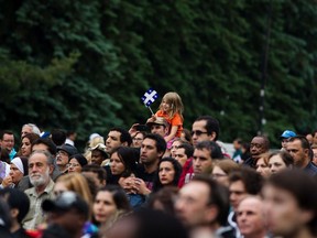 A girl waves a Quebec flag at Fête Nationale celebrations in Maisonneuve Park in Montreal in 2011.
