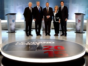 Bloc Quebecois Leader Gilles Duceppe, from left to right, Conservative Leader Stephen Harper, NDP Leader Tom Mulcair, Green party Leader Elizabeth May and Liberal Leader Justin Trudeau pose for photos before the French-language leaders' debate in Montreal on September 24, 2015.