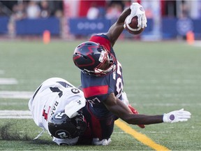 Montreal Alouettes' Eugene Lewis, right, is tackled by Ottawa Redblacks' Chris Randle at the one-yard line during the first quarter of their CFL football game in Montreal, Friday, August 2, 2019. The play was initially ruled a touchdown but revised to a tackle on review.
