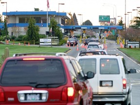 Vehicles line up to enter the United States at border crossing between Blaine, Washington and White Rock, British Columbia.