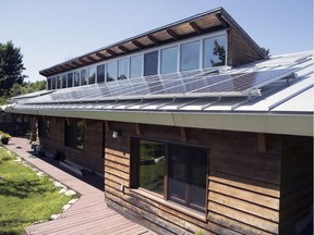 A Quebec couple's eco-friendly home in Hudson is seen on Thursday July 18, 2019.  The house faces due south to maximize the solar panels' exposure to the sun.