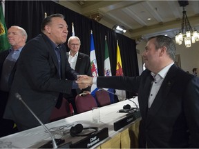 Alberta Premier Jason Kenney shakes hands with Quebec Premier Francois Legault following a closing news conference at a meeting of Canada's Premiers in Saskatoon, Sask. Thursday, July 11, 2019.