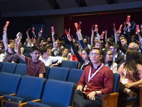 Quebec Liberal Party youth wing members vote on a proposition on interculturalism at the youth wing party congress, Sunday, August 11, 2019 in Quebec City.