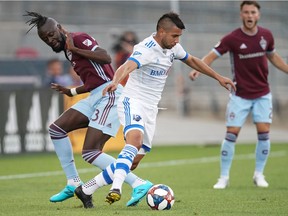 Aug 3, 2019; Commerce City, CO, USA; Montreal Impact midfielder Saphir Taider (8) battles for control of the ball against Colorado Rapids forward Kei Kamara (23) during the first half at Dicks Sporting Goods Park. Mandatory Credit: Troy Babbitt-USA TODAY Sports.