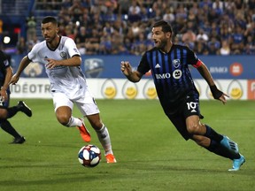 Impact midfielder Ignacio Piatti and Philadelphia Union midfielder Haris Medunjanin chase the ball during game at Saputo Stadium last week.