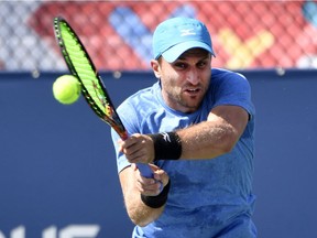 Steven Diez, a Toronto native who is based in Barcelona, recovered from a second-set lapse to defeat Yosuke Watanuki of Japan 6-2, 5-7, 6-0 on Wednesday.