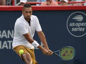 Australia's Nick Kyrgios from Australia hits a shot against Britain's Kyle Edmund during his first-round loss at the Rogers Cup in Montreal in 2019.