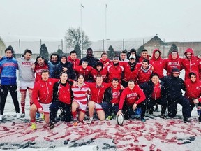 The McGill team strikes a pose in April 2017 after their victory in the Covo Cup rugby match against Harvard in Cambridge, Mass., which was played in ice, snow and slush.