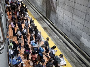 A crowd waits for a train on the métro's Green Line in this file photo.