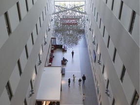 The Research Institute Atrium in Montreal, featuring a work by artist Nicolas Baier called Lustre (hémoglobine) — a 3D reproduction of a hemoglobin molecule made of reflective stainless steel, composed of about 4,500 spheres and almost as many rods — chosen for their iridescent effect. The atrium is also a rotating gallery space featuring works by local  professional artists.