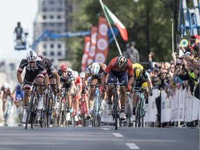 Team Sunweb's Michael Matthews (far left) comes in to the finish line to win the Grand Prix Cyclistes de Montreal cycling race in 2018.