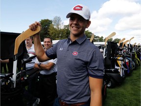 Canadiens' Jesperi Kotkaniemi checked out his clubs before heading out to the links at the Canadiens' charity golf tournament at Laval-sur-le-Lac on Monday, Sept. 9, 2019.
