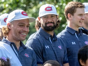 Canadiens forward Max Domi is all smiles at team’s annual golf tournament at Laval-sur-le-Lac on Sept. 9, 2019, while standing beside teammates Nate Thompson and Brett Kulak.