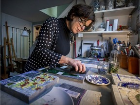 Susan Semenak polishes a mosaic in her home studio in Lachine.