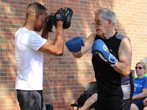 Murray McBain (right), seen here participating in a boxing demo with an instructor from Otis Grant Boxing at the 2018 SuperWalk, is very active with Parkinson Canada. He is a member of the Parkinson support group and boxing class at the Cummings Centre and a participant in many Parkinson Canada events and seminars.