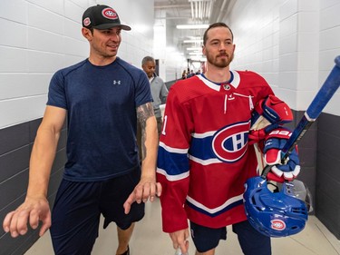 Opening day of training camp for the Montreal Canadiens involved off-ice testing at the Bell Sports Complexe in Brossard on Thursday September 12, 2019. Goaltender Carey Price and right winger Paul Byron, right, walk through the hallway on opening day of training camp. Dave Sidaway / Montreal Gazette ORG XMIT: 63135