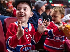 Cousins Liam Dutilly, 4, and Edouard Dutilly, 3, cheer on the Canadiens during team’s annual Red vs. White scrimmage at the Bell Centre in Montreal on Sept. 15, 2019.