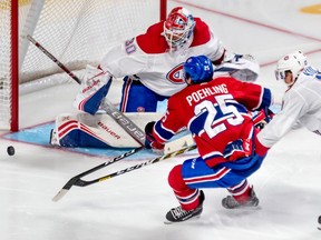 It was a full house to watch 42 players hit the ice at the annual Montreal Canadiens' Red White Scrimmage at the Bell Centre in Montreal on Sunday September 15, 2019. Centre Ryan Poehling can't get his stick on the loose puck with defensemen Brett Kulak checking from behind in front of goaltender Cayden Primeau.
