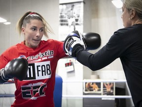 Boxer Kim Clavel, left, spars with her trainer Danielle Bouchard in preparation to fight Romania's Xenia Jorneac at the Montreal Casino at the end of the month.