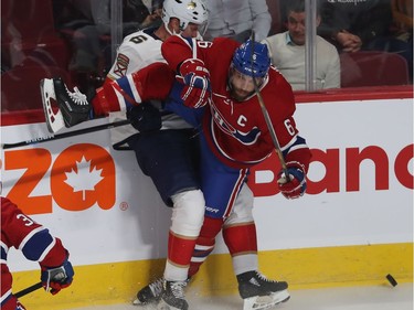 Montreal Canadiens' Shea Weber (6) is taken down by Florida Panthers' Anton Stralman (6) during first period NHL exhibition game in Montreal on Thursday September 19, 2019.