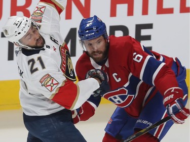 Montreal Canadiens' Shea Weber (6) holds back Florida Panthers' Vincent Trocheck (21) during NHL exhibition game in Montreal on Thursday September 19, 2019.