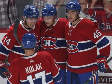 Montreal Canadiens' Jordan Weal (43) celebrates goal with teammates Nick Suzuki (14), Josh Brook (46) and Brett Kulak (17) during NHL exhibition game against the Florida Panthers in Montreal on Thursday September 19, 2019.