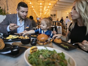 Marc-Olivier Brouillette dines with his son Calvin and his wife, Brittany Knapp, at the vegan restaurant Lov on Wednesday, Sept. 11, 2019.