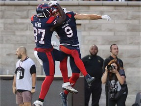 Alouettes' Jake Wieneke (9) celebrates his touchdown with teammate Eugene Lewis to tie the game in the dying seconds of the fourth quarter against the Winnipeg Blue Bombers in CFL action in Montreal on Saturday Sept. 21, 2019.