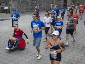 People ran and rolled through Old Montreal as thousands of people took part in the Marathon Oasis de Montreal Sunday, September 22, 2019 in Montreal.
