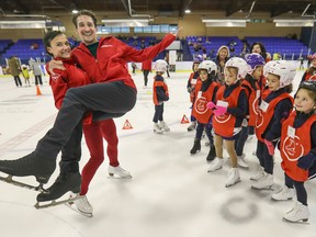 Skate Canada National Team member Liubov Ilyushechkina reverses roles and lifts her pairs skating partner Charlie Bilodeau while skating with kids in the Town of Mount Royal Figure Skating Club in Montreal Monday September 23, 2019.