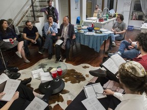 Rabbi Avi Finegold (centre with scarf) leads a boot camp at the Montreal Moishe House on Thursday, Sept. 19, 2019 to help young adults prepare for the Jewish high holidays.