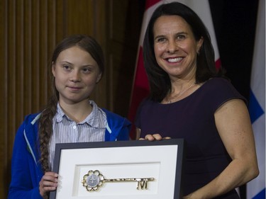 Swedish climate activist Greta Thunberg gets the key to the city from Montreal Mayor Valérie Plante after the climate march on Friday, Sept. 27, 201,  in Montreal. Thunberg and Plante met privately before there was ceremony where Thunberg received the key to the city and signed the Golden Book of the city.