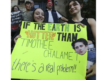 Téa Verdene, left, and Anna Fraser take part in climate march in Montreal on Friday, Sept. 27, 2019.