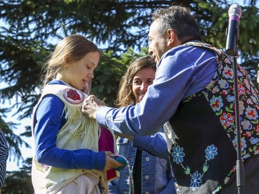 Perry Bellegarde, National Chief of the Assembly of First Nations, presents Swedish climate activist Greta Thunberg with a native vest during press conference prior to the climate march in Montreal on Friday, Sept. 27, 2019.