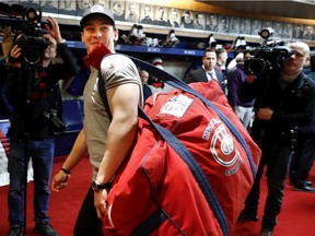 Canadiens forward Charles Hudoncarries his bag out of the locker room after speaking to the media as players cleared out their lockers at the Bell Sports complex in Brossard on April 9, 2018.