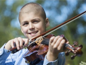 Violinist Léandre Gaucher, 10, plays at home in Beaconsfield. Gaucher, who recently underwent treatment for a brain tumour, is taking part in the Concert For Kids With Cancer being held Oct. 5 in Pointe-Claire.