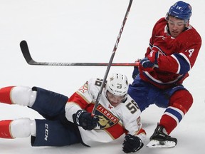 Canadiens prospect Nick Suzuki, right, and Panthers' Jake Massie collide during the second period of pre-season action at the Bell Centre Thursday night.