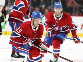 Canadiens Max Domi in action with linemates Jonathon Drouin, right, and Artturi Lehkonen during game last season. The line was reunited during Habs practice on Friday.
