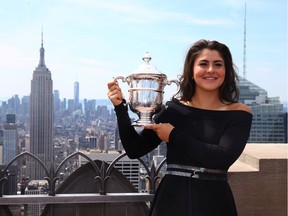 Bianca Andreescu of Canada poses with her trophy at the Top of the Rock in Rockefeller Center on September 8, 2019 in New York City.