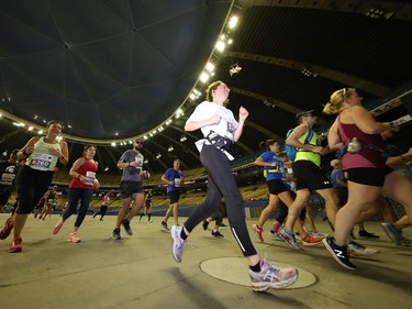 Competitors run inside Olympic Stadium during the Oasis International Marathon de Montreal - Day 2 on Sept. 22, 2019 in Montreal.