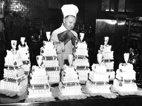 In a photo dated Sept. 6, 1952, Chef John Pellerino puts the finishing touches on only one day's quota of wedding cakes at the Ritz-Carlton Hotel.