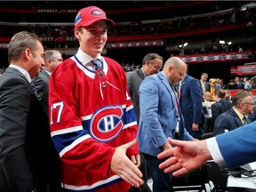 Defenceman Cale Fleury meets with Canadiens management team after being selected in the third round (87th overall) of the 2017 NHL Draft at the United Center in Chicago.