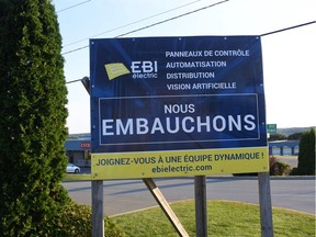 A "hiring" sign in St-Georges, about 300 kilometres northeast of Montreal, in 2018.